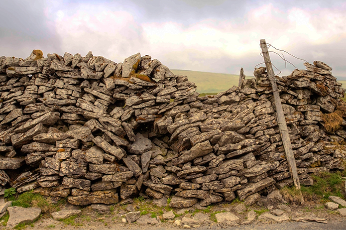 Merchant-and-Makers-Dry-Stone-Walls-29-Collapsed-dry-stone-wall-Gayle-Mountain,-Hawes
